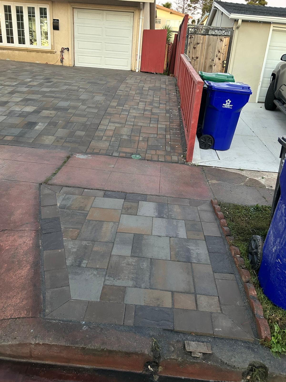 Paver driveway with charcoal border and multi-tone paver entry section